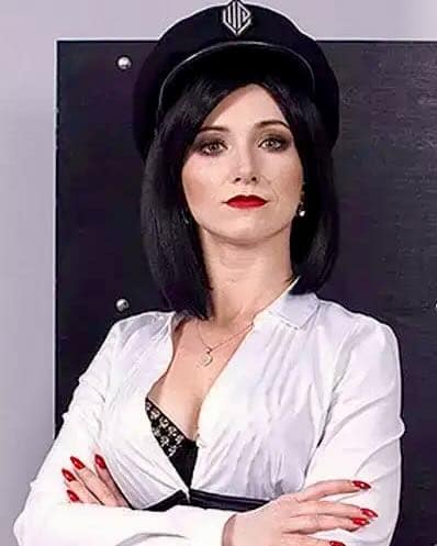 Lady Daria, Warsaw dominatrix and creator of Warsaw Prison, wearing a black officer cap