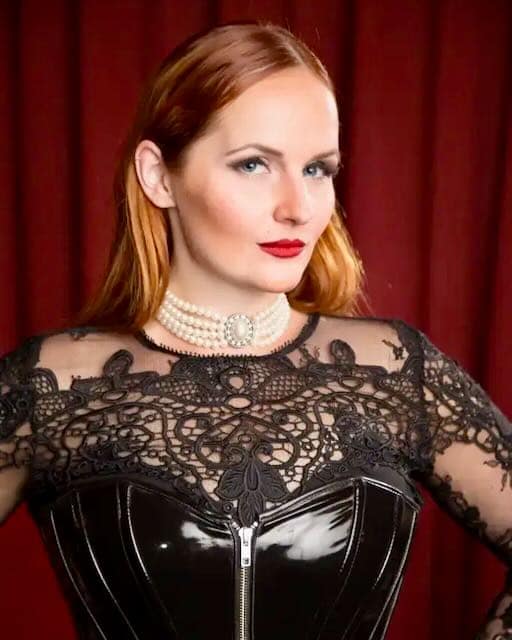 Cassandra van Cane, Zurich-area dominatrix in black corset and lace