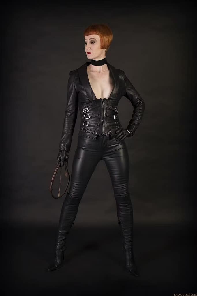 Redhead English Dominatrix with a penchant for punishment, and the epitome of elegant sadism: Domina Liza.