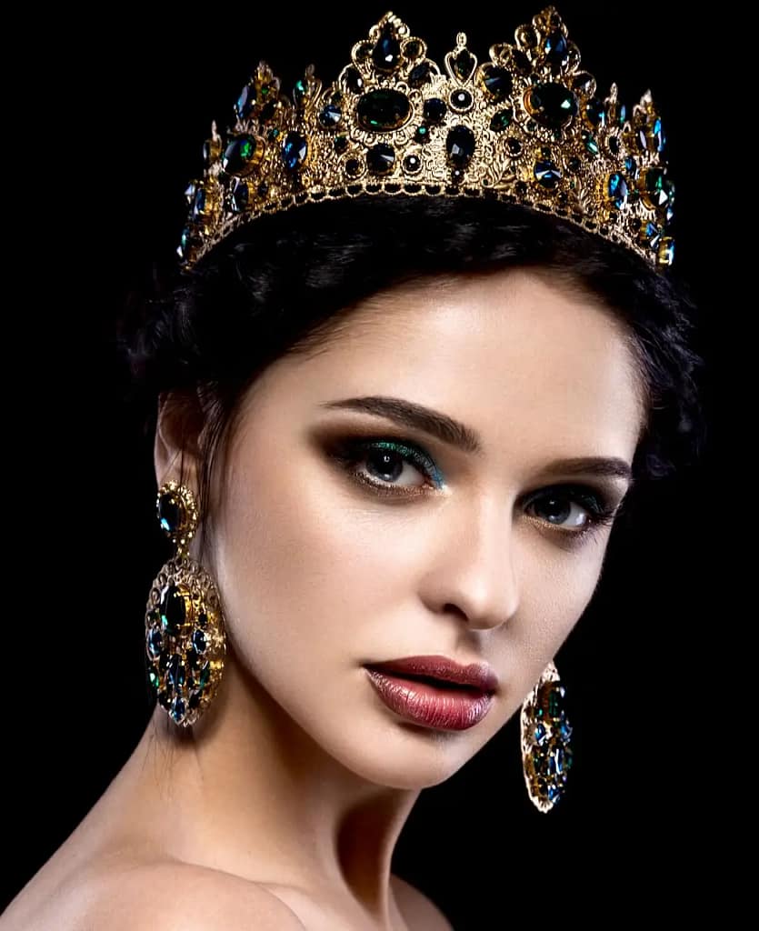 Beautiful woman wearing an ornate golden crown, symbolizing confidence, leadership, and empowerment in a Female Led Relationship.